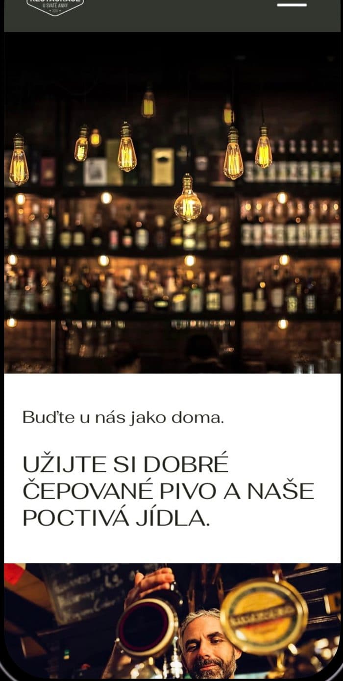 Web restaurace U Sv. Anny na iPhonu s velkou fotkou a menu